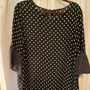 Black & white polka dot polyester shirt with round neckline & ruffled sl…